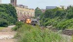CSX 3195 sees the rear end of M370 right at the Exchange St. signals.